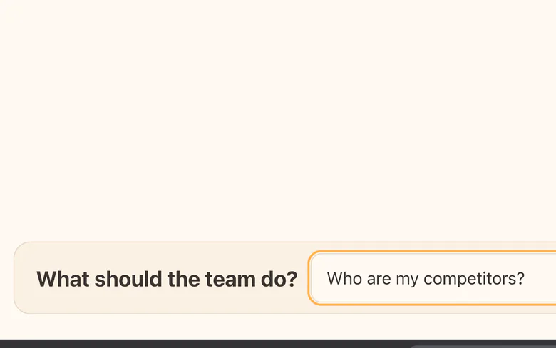 The brief box with "Who are my competitors?" typed in, before you press Send.